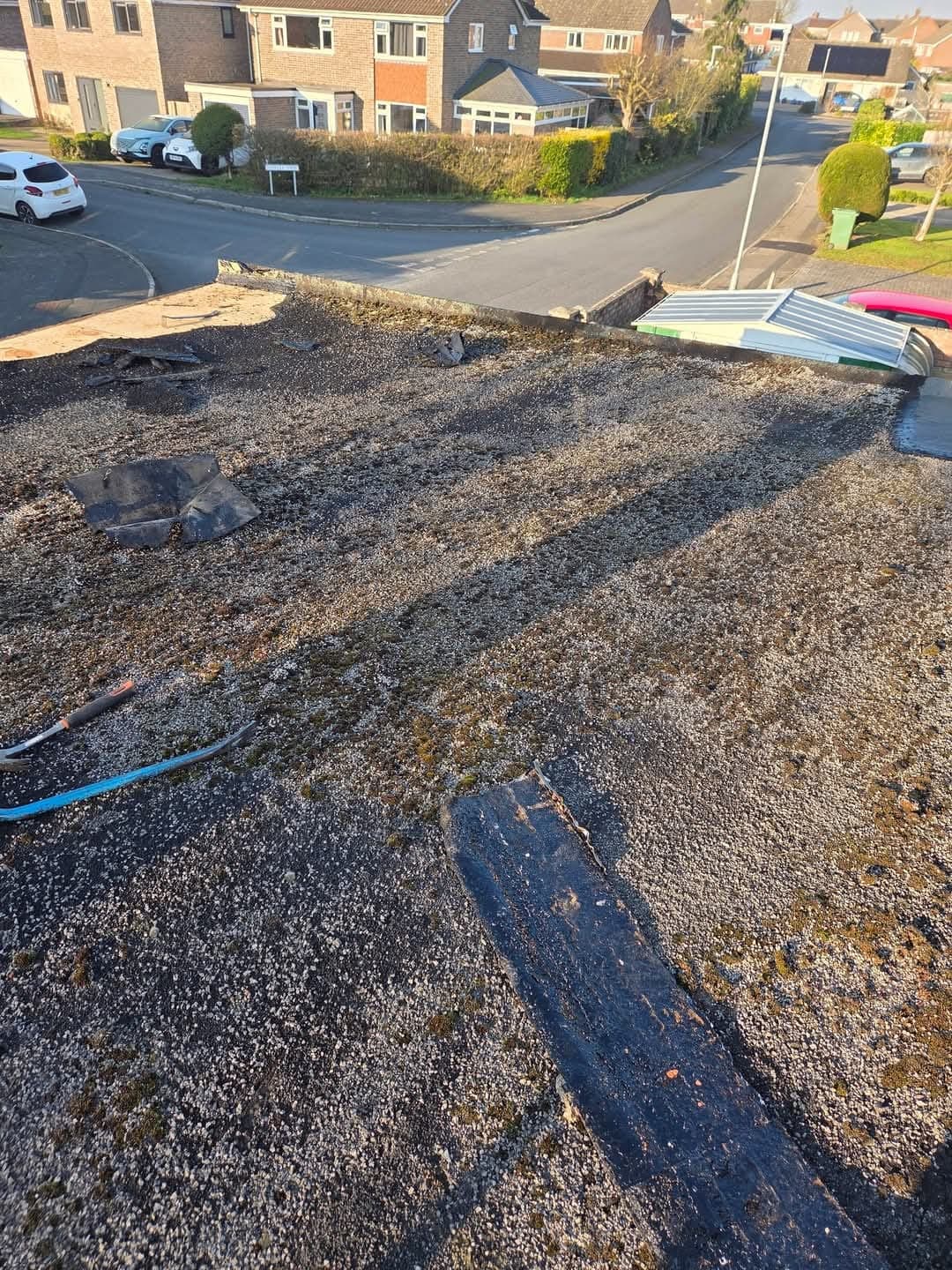 Worn felt roof before stripping